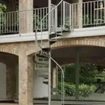 adjustable height aluminum spiral staircase up to deck at boat dock